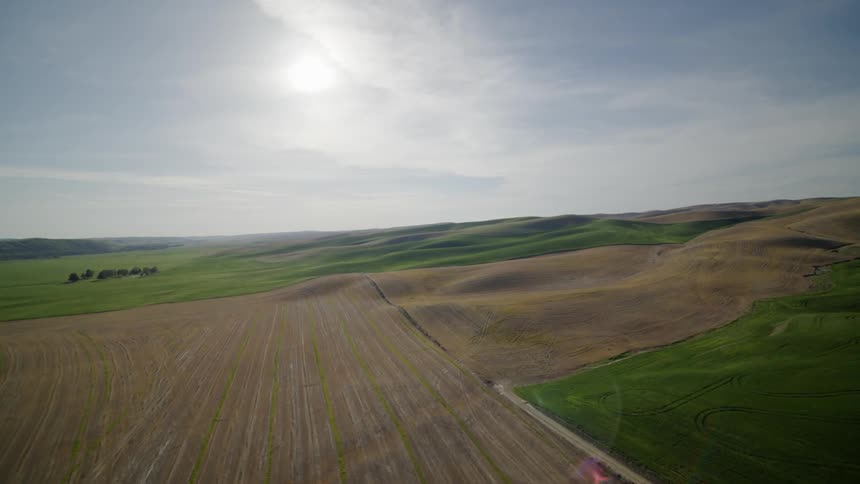 Reveal of beautiful rolling farmland foothills