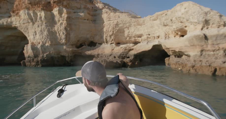 A man rides on a speedboat