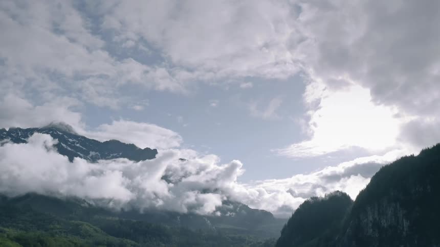 Clouds gather over mountains