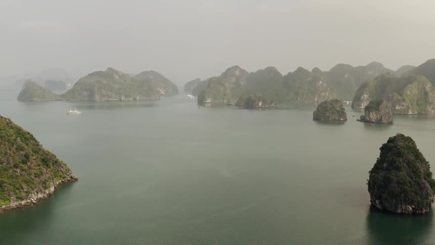 Rock formations stand in water