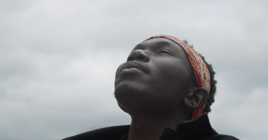 Man looks up towards the sky