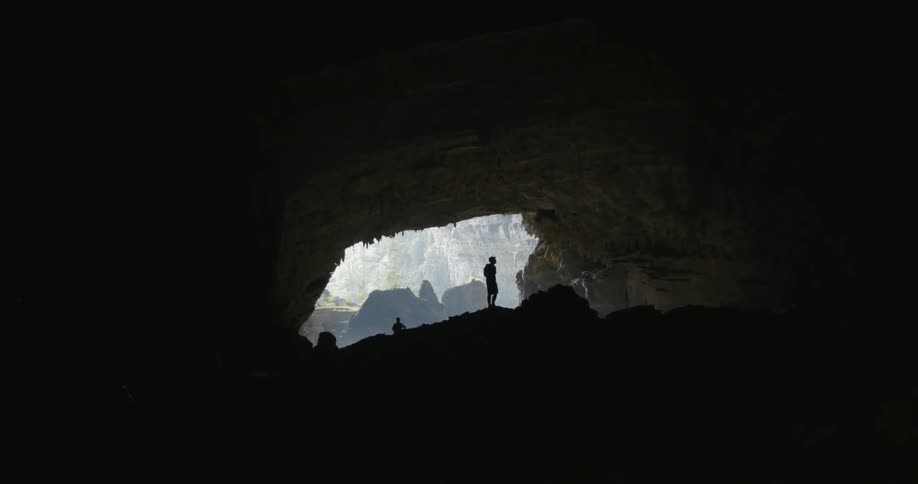 People exploring a cave