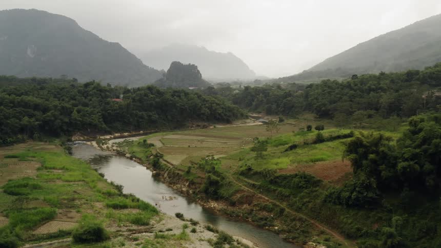 The fields below have a stream running through the middle