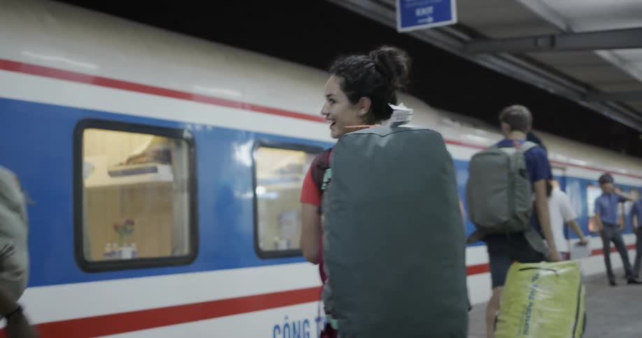 People walk in a train station