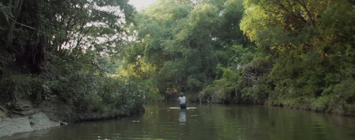 Man wades in a river