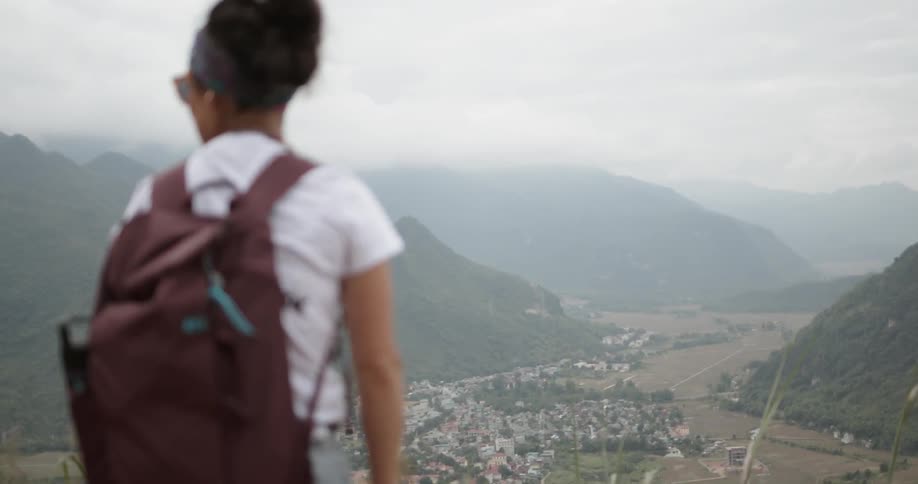 A woman hikes in mountains