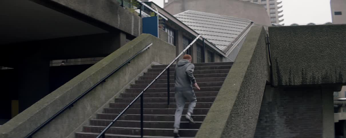 Man runs up steps while exercising