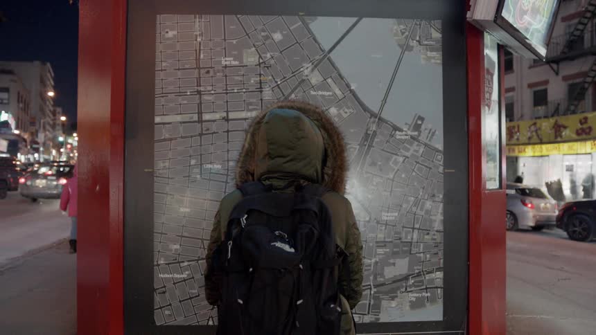 Woman looks at a city map