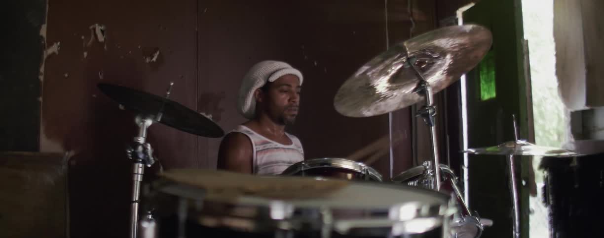 A man plays the drums
