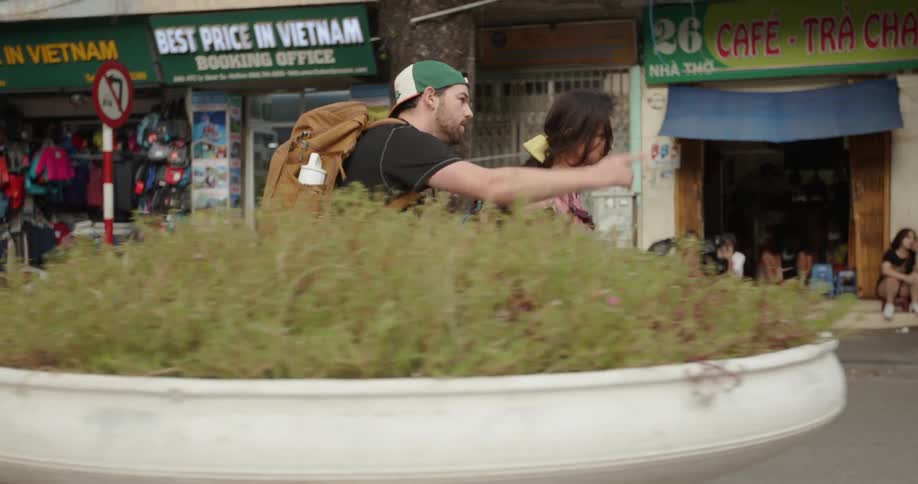 Man and woman tourists are walking down street in vietnam