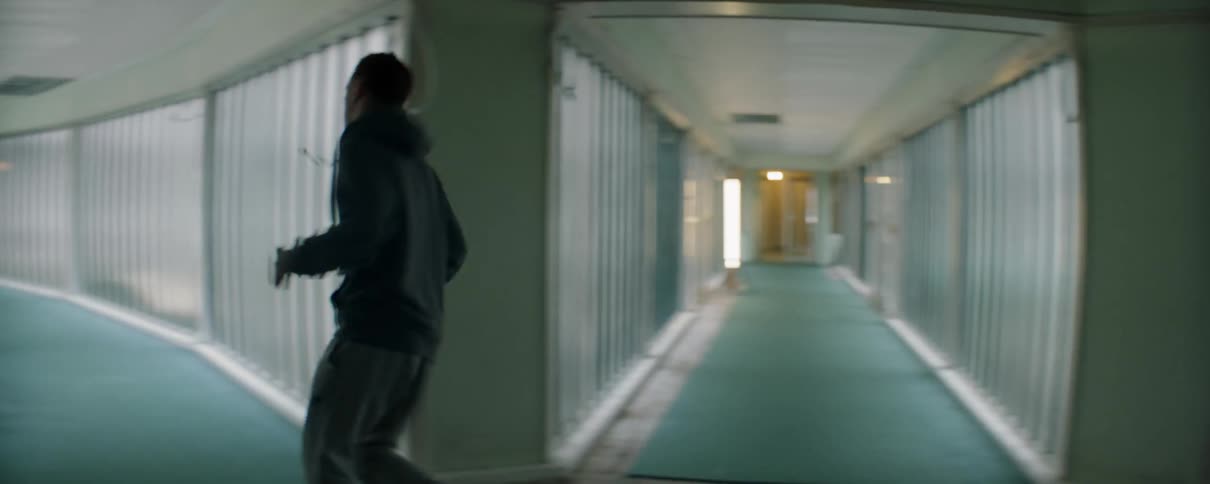 Man jogs in a hallway