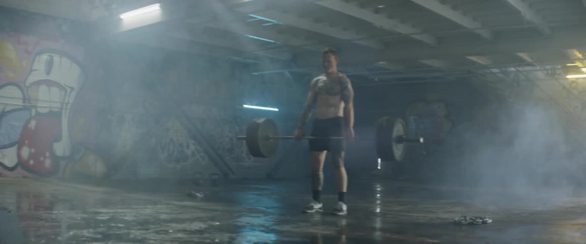 A man is lifting heavy weights