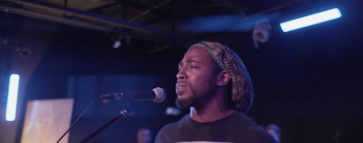 A man sings on stage