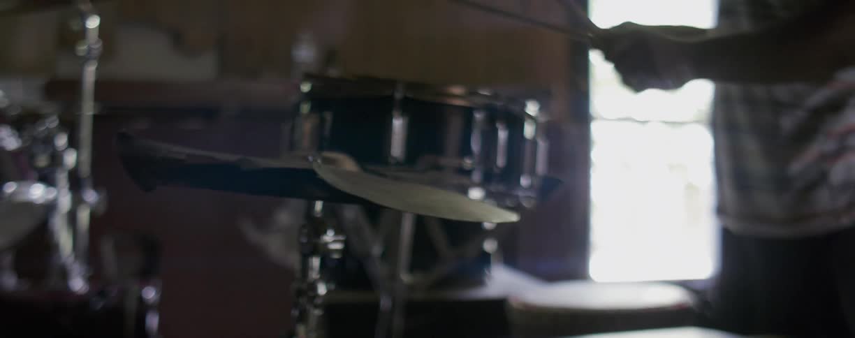 A man plays the drums