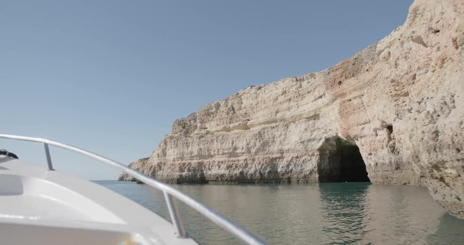 Boat travels towards an opening in the rocks