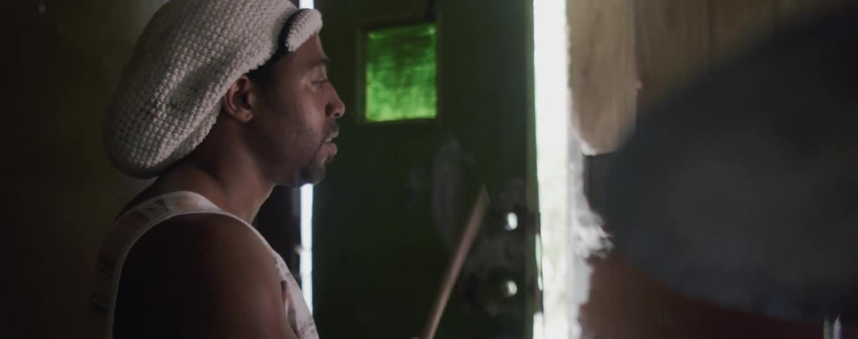Man is playing the drums inside house