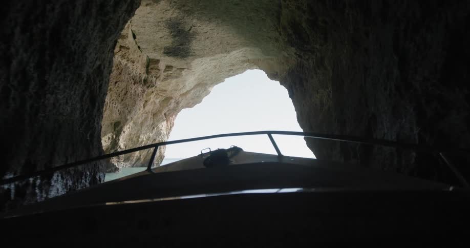 A boat floats through a cavern