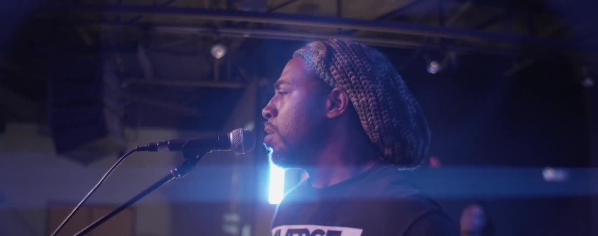 A man sings on stage