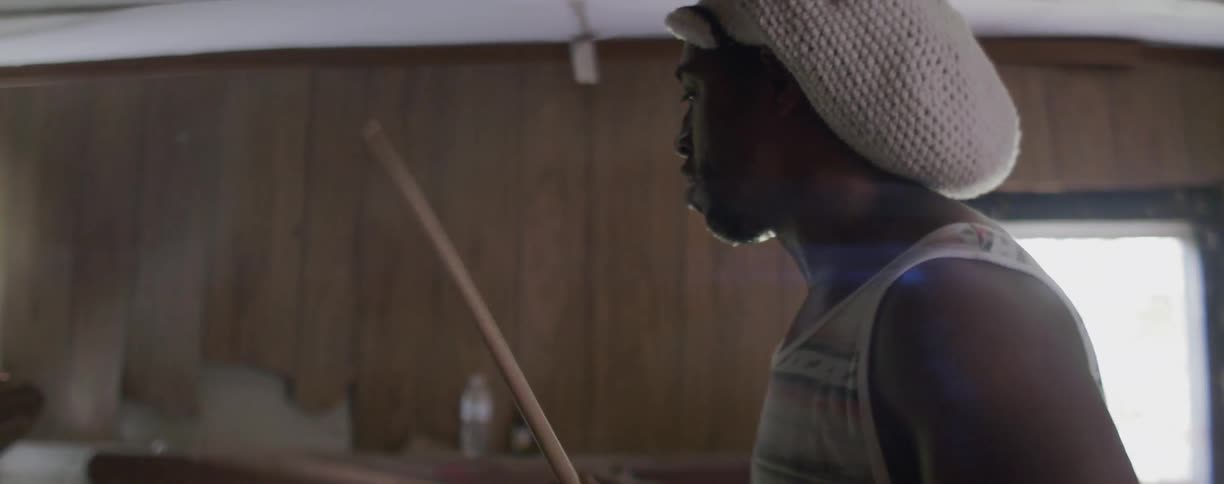 A man plays on a drum set