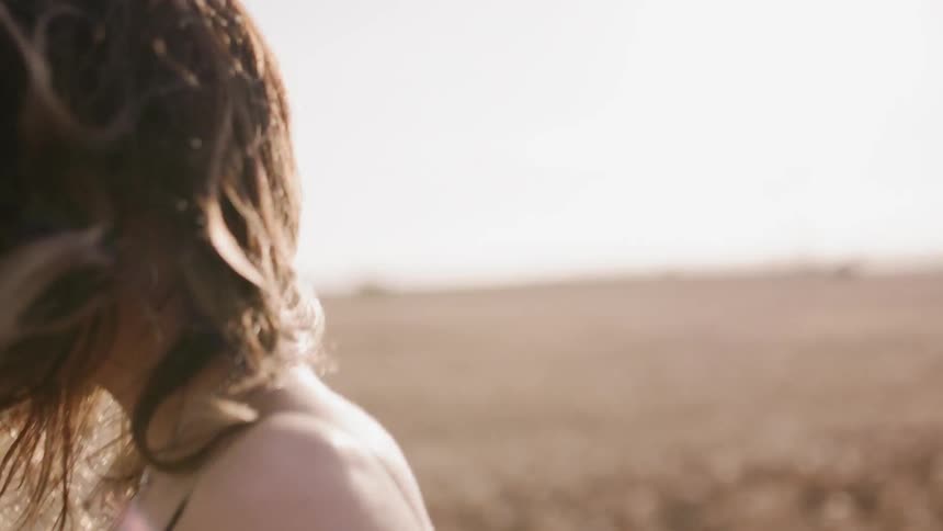 Woman screams in a rural field