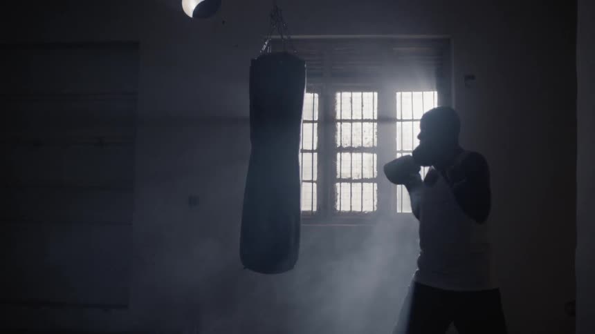 Man hits a punching bag