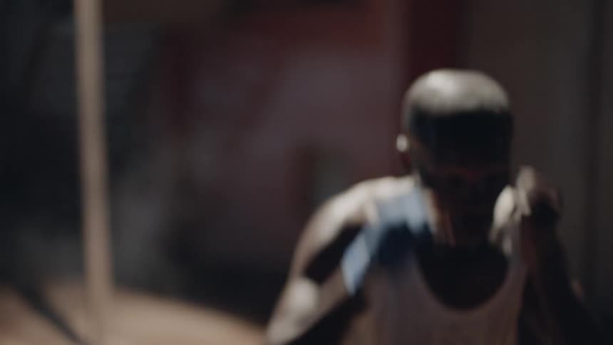 A boxer punches the air