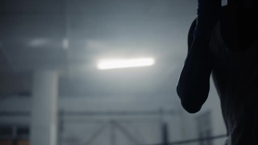 Man working out in boxing gym