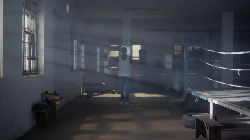 Man jumps rope in boxing gym