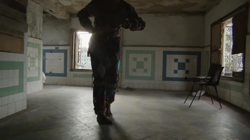 A person in costume is dancing