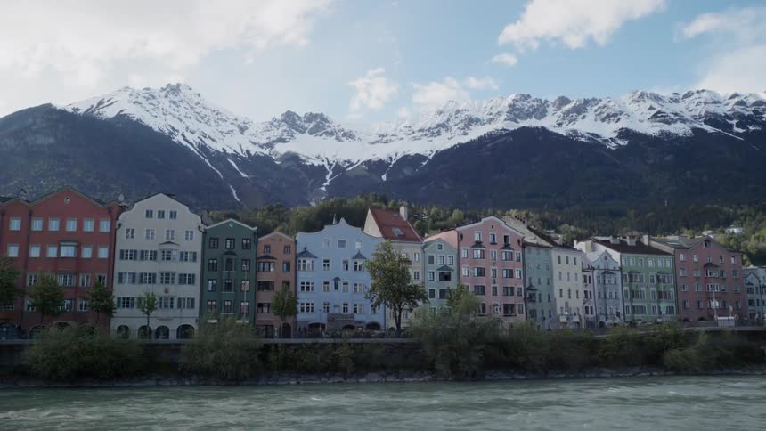 Row of buildings sit near the river