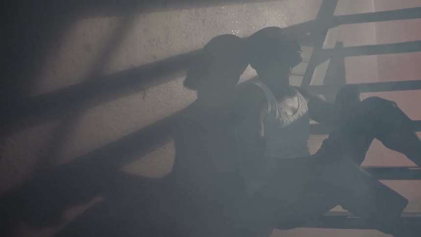 Man sits on building steps at night