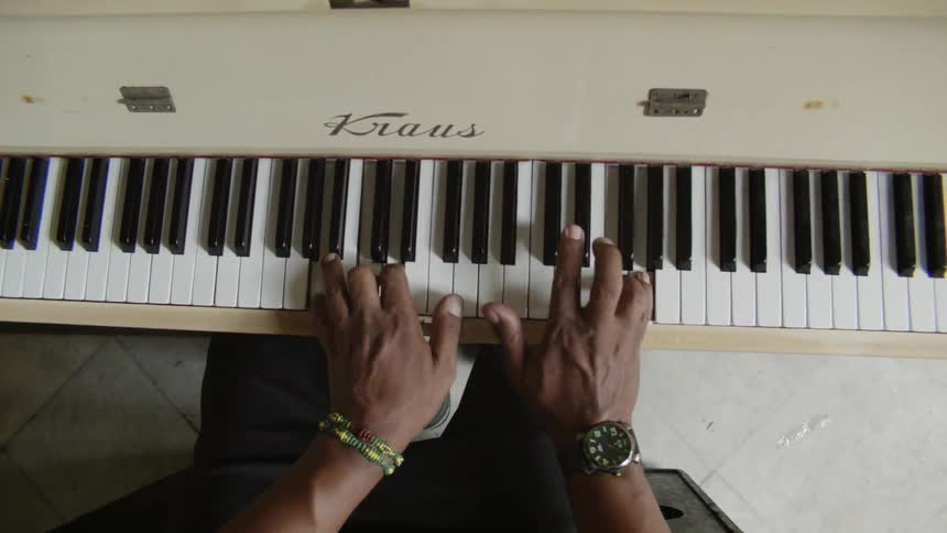 A person plays the piano in the room