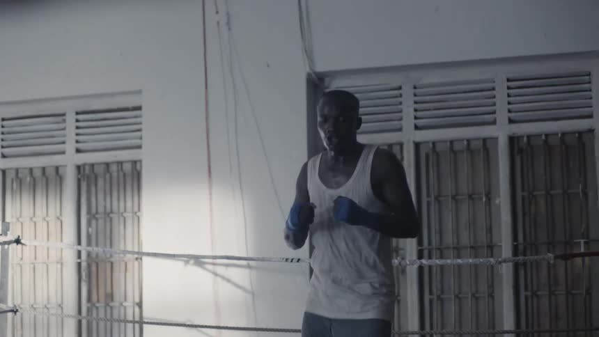 Man hops up and down and boxes