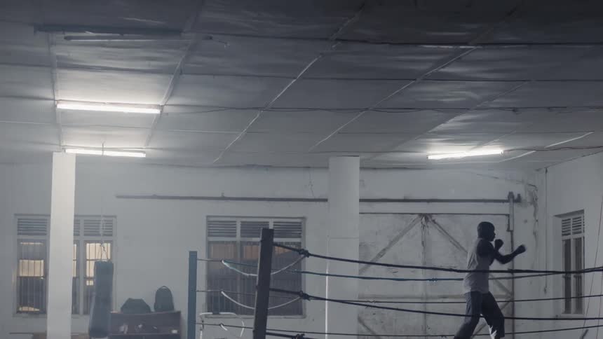 A man trains in a boxing ring