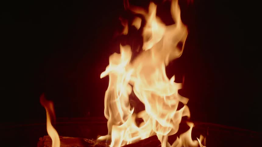 A campfire burning at night