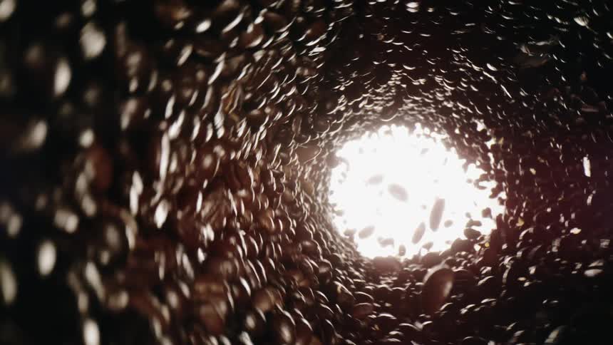 Coffee beans are spinning inside machine