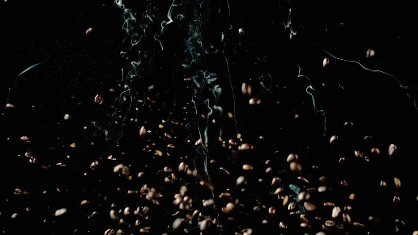 Coffee beans fall through the air