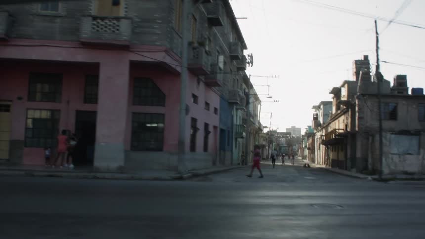 A car drives on a city street