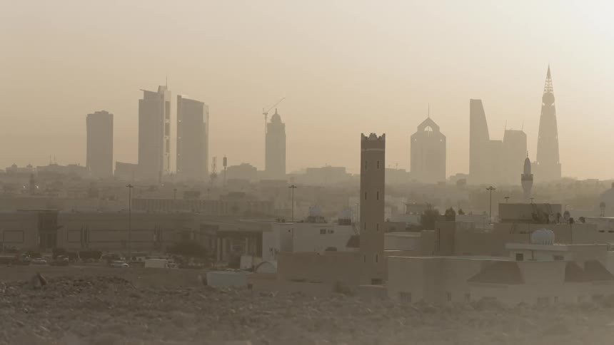 A dust storm is lingering in the air of middle eastern location in daylight