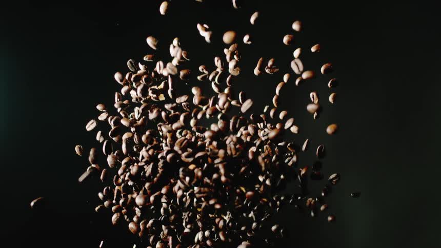 The coffee beans are thrown into the air