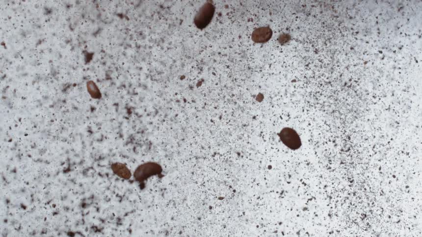 Coffee beans and grounds are falling down