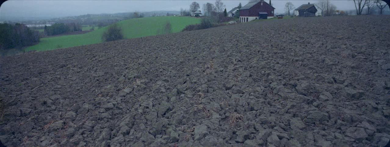A house sits on a rural hill