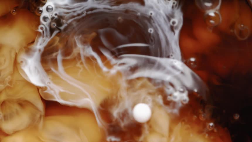 Creamer is pouring into coffee