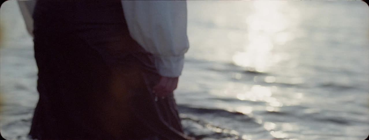 A person wades into the water