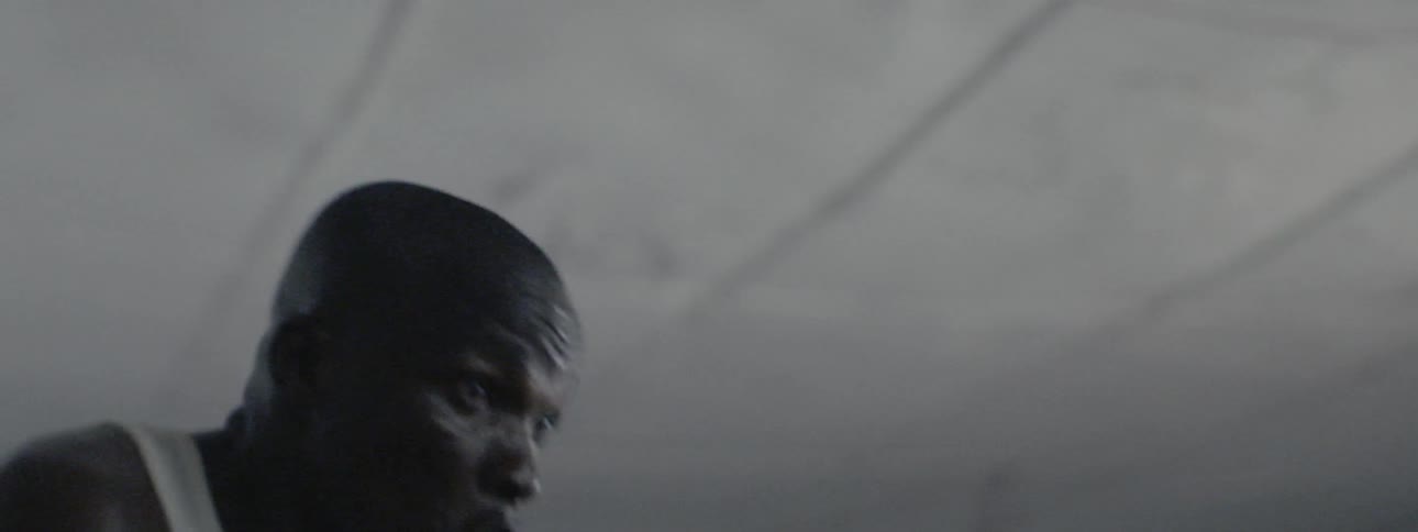 The man is shadowboxing in the ring