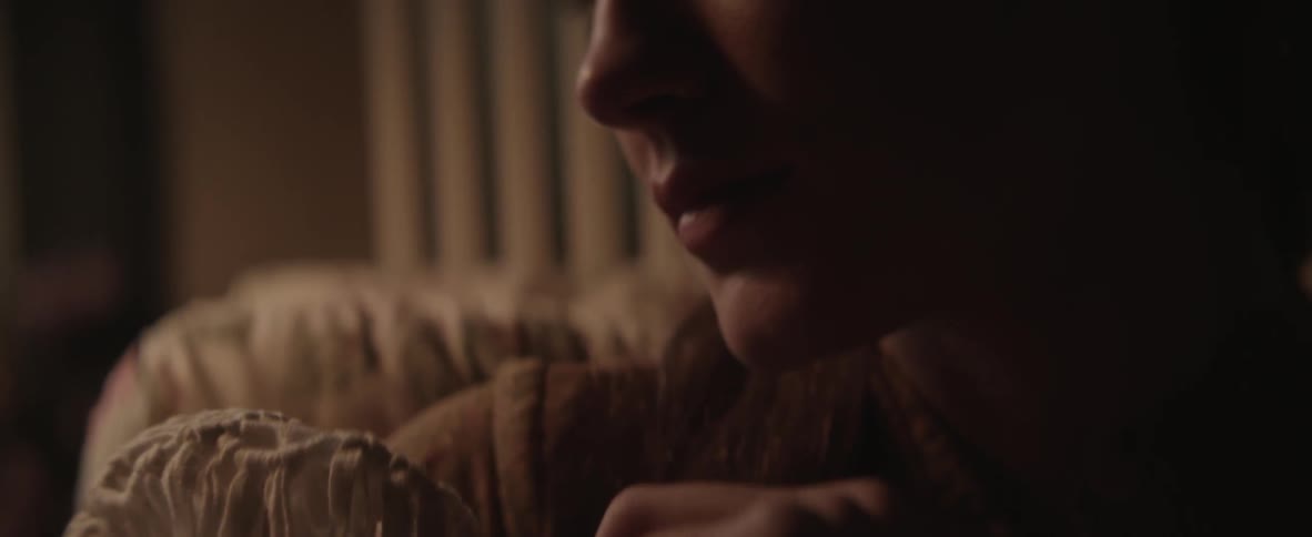 Woman rocking something looks over to her side
