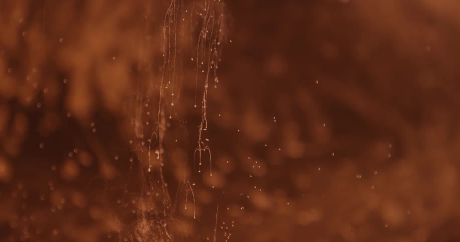 Drops moving in front of a red area