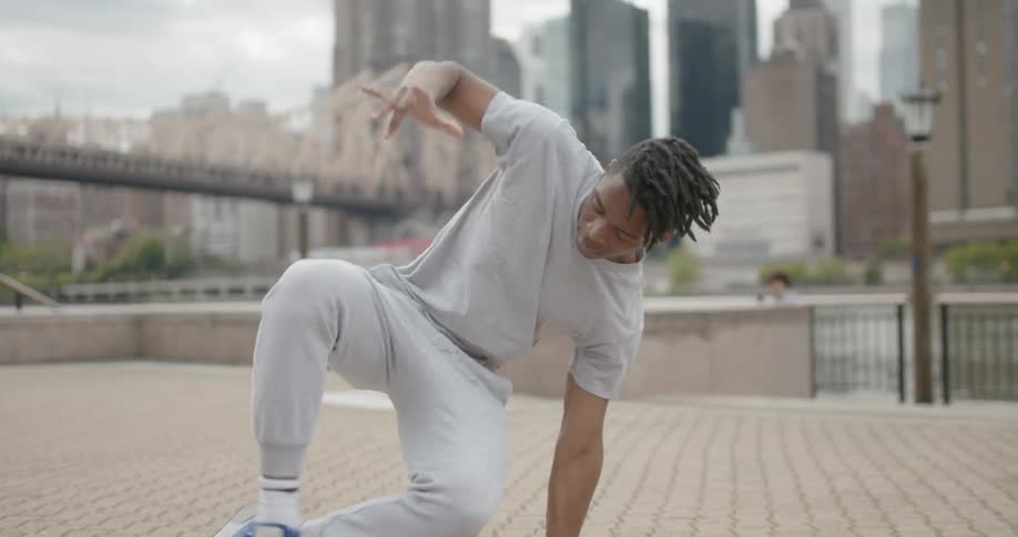 A man break dances outside