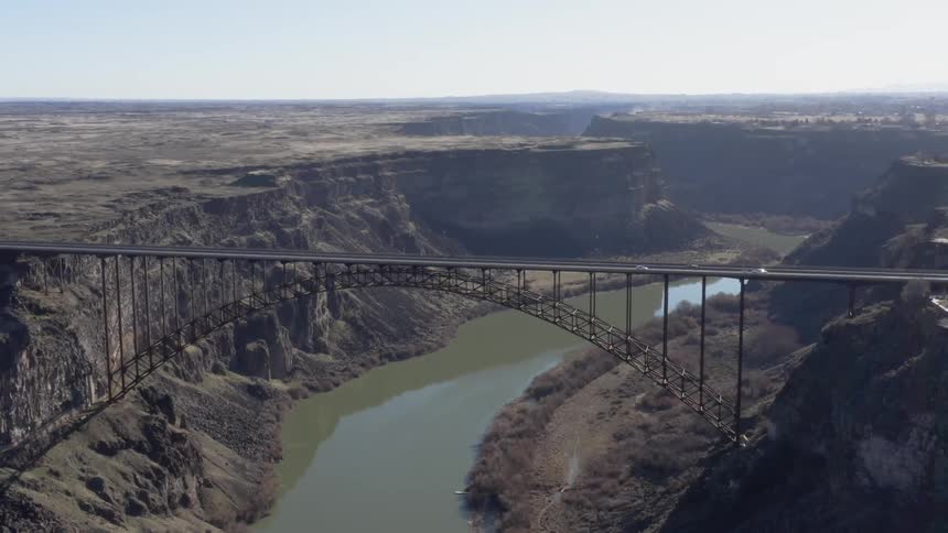 Vehicles pass over the canyon bridge
