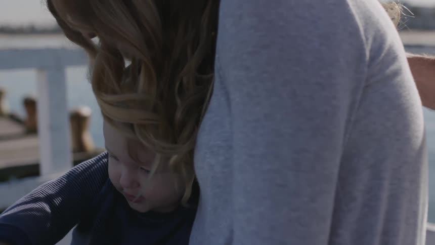Mother comforts her toddler